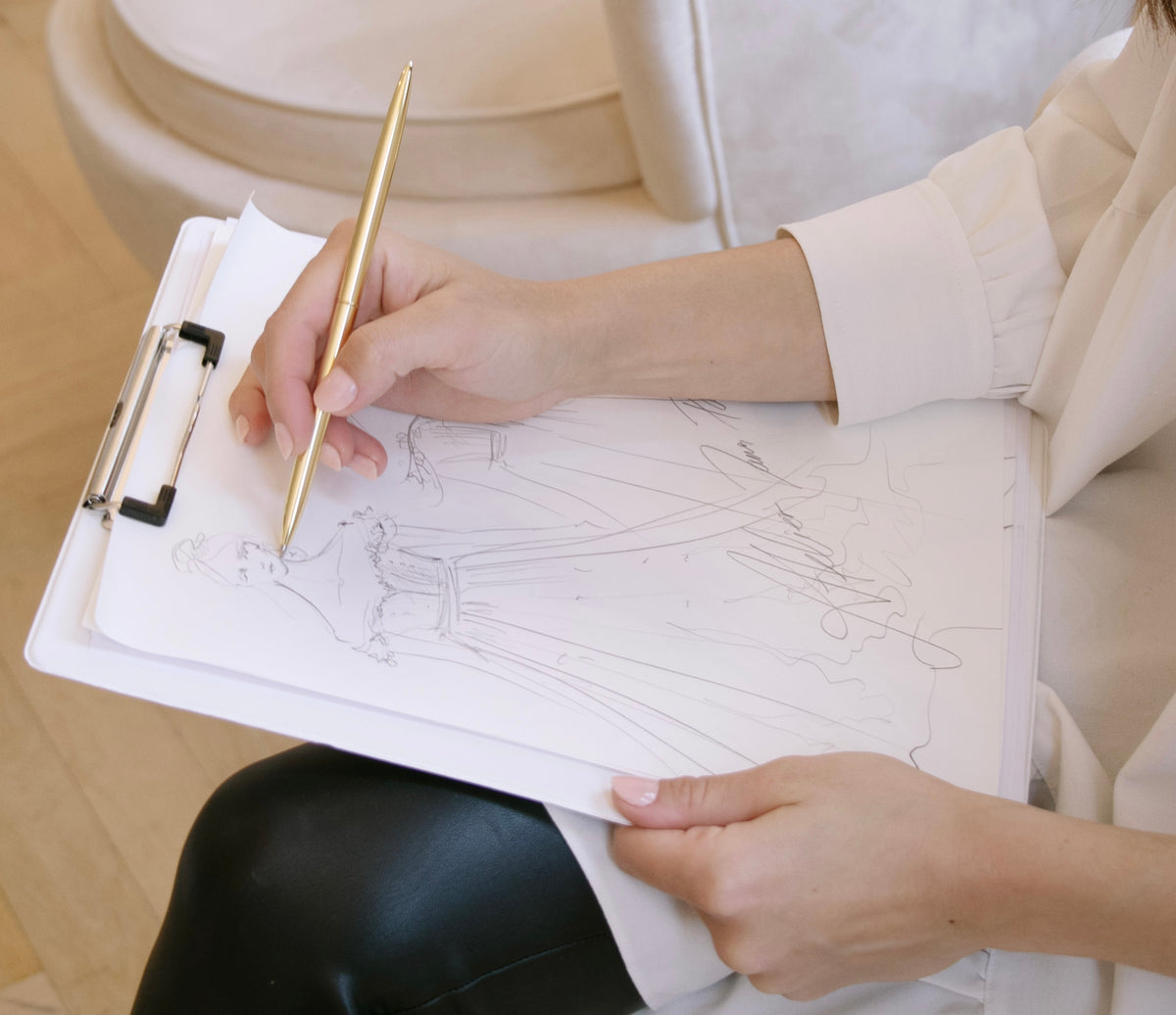 Jana Paulin sketching a made-to-measure wedding dress design