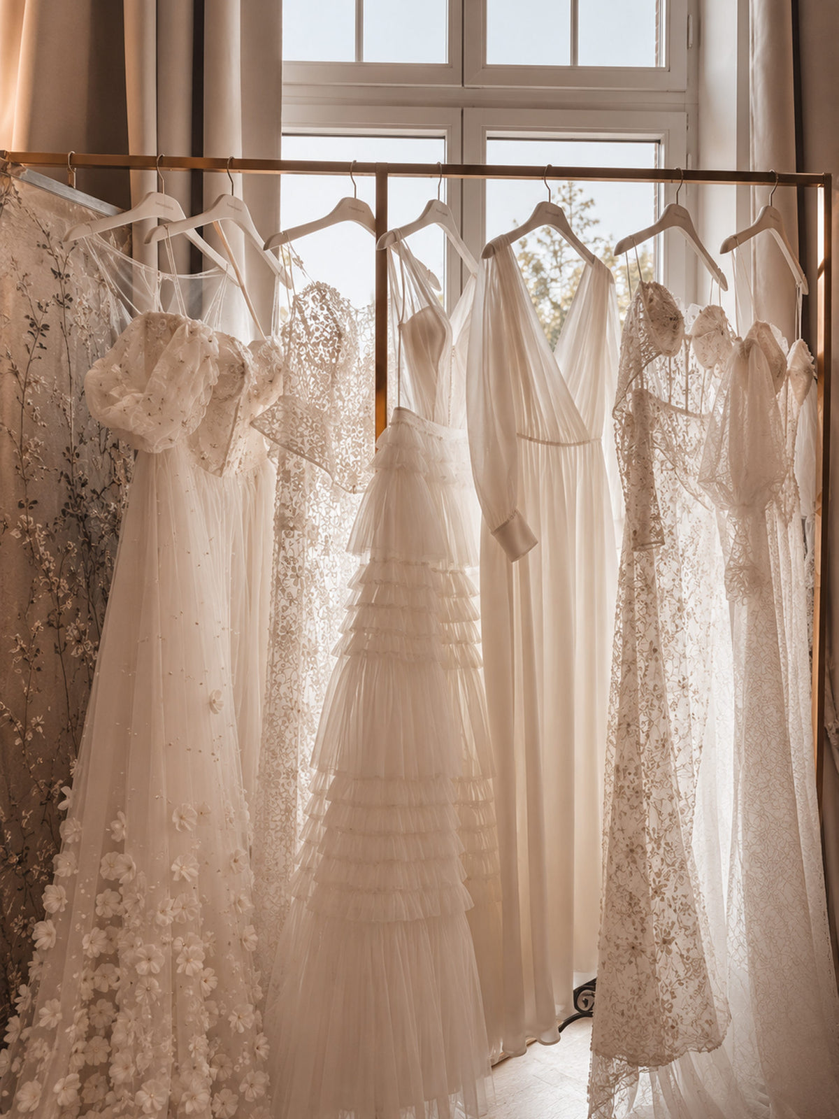 Wedding dresses from the exclusive collection by the window at Atelier Jana Paulin Berlin