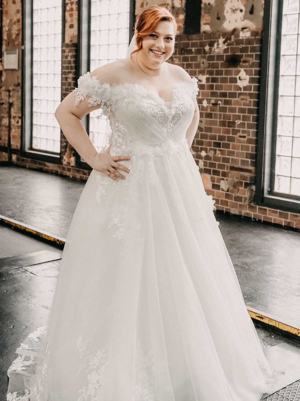 Off-shoulder curvy wedding dress with lace – plus-size bridal wear Berlin